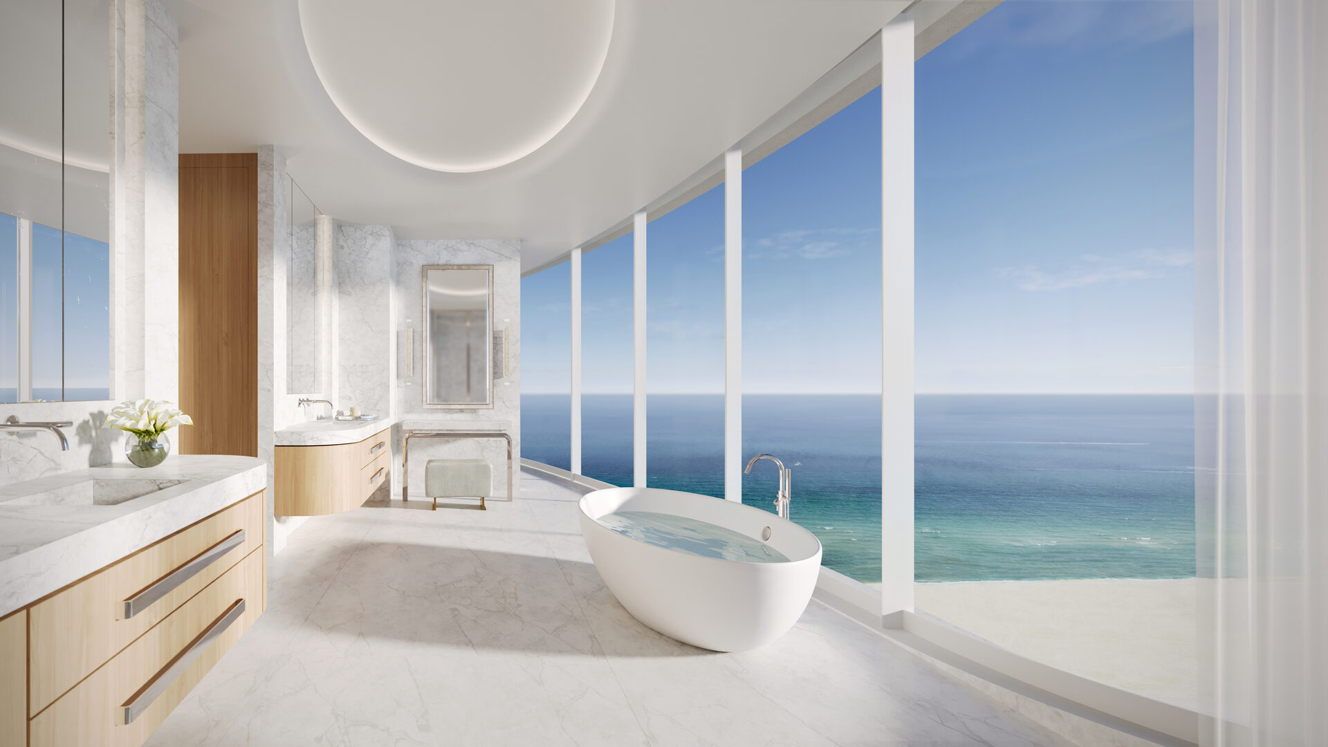 Primary bath with freestanding tub and ocean view